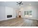 Living room with vaulted ceilings, hardwood floors, and a modern fireplace at 4120 Emily Ln, Oxford, NC 27565