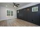Spacious office with dark stained wall paneling and wood-look flooring at 4120 Emily Ln, Oxford, NC 27565