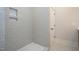 Grey tiled shower with marble pebble floor and niche shelving at 4120 Emily Ln, Oxford, NC 27565