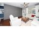 Spacious living room featuring a gray accent wall and comfortable seating at 420 Farintosh Valley Lane Ln, Durham, NC 27703