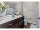 Clean bathroom with dark brown vanity, shower, and toilet at 430 Heart Pine Dr, Wendell, NC 27591