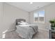 Bedroom with plush bed and window with blinds at 430 Heart Pine Dr, Wendell, NC 27591