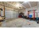 Garage with overhead storage and home gym setup at 430 Heart Pine Dr, Wendell, NC 27591