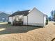 White house with wooden deck and backyard at 430 Heart Pine Dr, Wendell, NC 27591