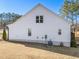 White house exterior with windows and AC unit at 430 Heart Pine Dr, Wendell, NC 27591