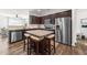 Island kitchen with granite countertops and stainless steel appliances at 430 Heart Pine Dr, Wendell, NC 27591