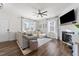 Bright living room featuring a cozy sectional sofa and fireplace at 430 Heart Pine Dr, Wendell, NC 27591
