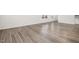 Light brown wood-look laminate flooring throughout the main living area at 5016 Tura St, Raleigh, NC 27610