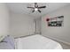 Well-lit bedroom with a queen-size bed and ceiling fan at 5220 Trilogy Farm Dr, Raleigh, NC 27603