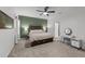 Bright bedroom featuring a comfortable bed, accent wall, and built-in dresser at 5220 Trilogy Farm Dr, Raleigh, NC 27603