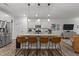 Modern kitchen with an island, stainless steel appliances, and granite countertops at 5220 Trilogy Farm Dr, Raleigh, NC 27603