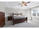 Spacious bedroom with wooden furniture and a ceiling fan at 5516 Reach Dr, Raleigh, NC 27616