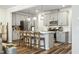 Modern kitchen with white quartz counters and gray cabinets at 5825 Humanity Ln, Raleigh, NC 27616