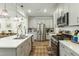 Modern kitchen with stainless steel appliances and an island at 5825 Humanity Ln, Raleigh, NC 27616