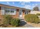 Front view of brick ranch house with landscaping and walkway at 630 Holly St, Burlington, NC 27217