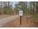 Community dock access with wooded walking path at 95 Somerset Ln, Henderson, NC 27537