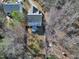 Aerial view of home, deck, and yard with mature trees at 109 Stoneline Ct, Holly Springs, NC 27540
