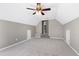 Spacious attic featuring neutral carpeting and walls and a ceiling fan at 109 Stoneline Ct, Holly Springs, NC 27540