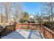 Spacious deck provides great view of level, fenced backyard at 109 Stoneline Ct, Holly Springs, NC 27540
