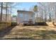View of the backyard with deck featuring a classic two story home at 109 Stoneline Ct, Holly Springs, NC 27540