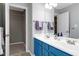 Bright bathroom features a double vanity and a closet, providing ample storage and functionality at 109 Stoneline Ct, Holly Springs, NC 27540