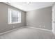 Bedroom featuring neutral walls and carpeting and a window with white blinds at 109 Stoneline Ct, Holly Springs, NC 27540