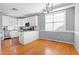 Kitchen dining area with hardwood floors and large window at 109 Stoneline Ct, Holly Springs, NC 27540