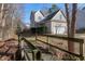 Home exterior features a side-entry garage and walkway with a small bridge at 109 Stoneline Ct, Holly Springs, NC 27540