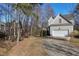 Home exterior shows garage and a bridge to the side of the property at 109 Stoneline Ct, Holly Springs, NC 27540
