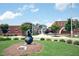 Inviting library building and grounds feature modern architecture and landscaping at 109 Stoneline Ct, Holly Springs, NC 27540