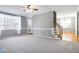 Spacious living room with hardwood floors, neutral walls, and access to backyard at 109 Stoneline Ct, Holly Springs, NC 27540