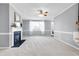 Bright living room with fireplace and neutral carpeting at 109 Stoneline Ct, Holly Springs, NC 27540