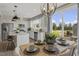 Open kitchen dining area with granite counter tops and stainless appliances at 115 Siebold St, Garner, NC 27529