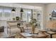 Open living space with contemporary decor, including a gray sofa and views of the kitchen at 115 Siebold St, Garner, NC 27529