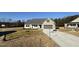 Newly built Craftsman style home with gray two-car garage at 117 Hydrangea Ln, Benson, NC 27504