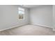 Bright bedroom with carpet flooring and large window at 1423 Bridgewater Dr, Durham, NC 27704