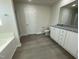 Bathroom with granite countertop, tub, and shower at 171 Wynd Crest Way, Benson, NC 27504
