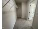 Large walk-in closet with wire shelving for hanging clothes at 171 Wynd Crest Way, Benson, NC 27504