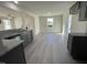 Kitchen dining area with hardwood floors and access to the backyard at 171 Wynd Crest Way, Benson, NC 27504