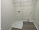 Laundry room with shelving and drain at 171 Wynd Crest Way, Benson, NC 27504
