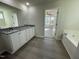 Main bathroom with double vanity, granite countertop and garden tub at 171 Wynd Crest Way, Benson, NC 27504