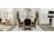 Elegant dining room with a wood table, black chairs, and a large mirror at 1848 Poe Farm Ave, Apex, NC 27502