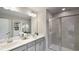 Double vanity bathroom with a large shower and plenty of light at 1878 Sweet Gardenia Way, Apex, NC 27502