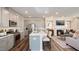 Open concept kitchen features stainless steel appliances and an island at 1878 Sweet Gardenia Way, Apex, NC 27502