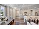 Island kitchen features white quartz countertops and stainless steel appliances at 1878 Sweet Gardenia Way, Apex, NC 27502