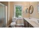 Bathroom with dual sinks, a shower, and a window at 200 Cedarwood Dr, Erwin, NC 28339