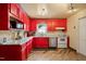Bright kitchen with red cabinets and stainless steel appliances at 200 Cedarwood Dr, Erwin, NC 28339