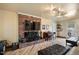 Living room featuring a brick fireplace and hardwood floors at 200 Cedarwood Dr, Erwin, NC 28339