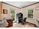Home office with a computer setup and ample natural light at 200 Cedarwood Dr, Erwin, NC 28339