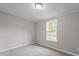 Simple bedroom with a single window and neutral walls at 262 Homestead Dr, Selma, NC 27576